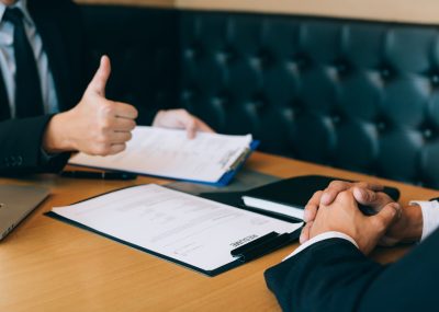 Job interviewer give a thumbs-up for job applications for new employee in the office room.